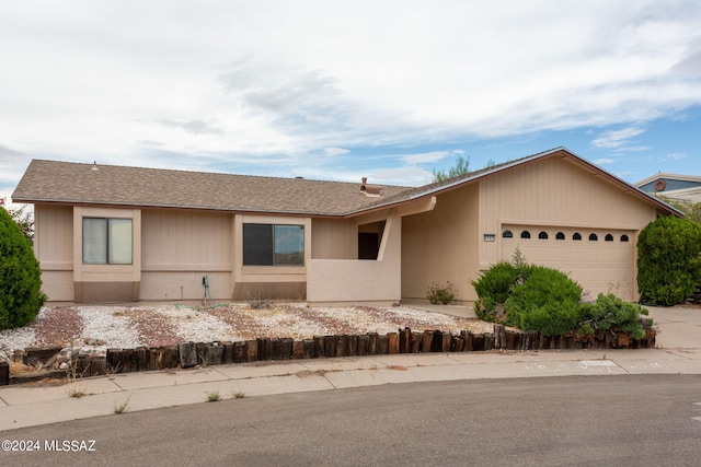 ranch-style home featuring a garage