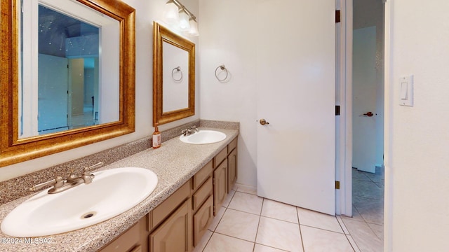 bathroom with vanity and tile patterned flooring