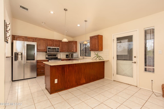 kitchen featuring stainless steel appliances, vaulted ceiling, tasteful backsplash, kitchen peninsula, and pendant lighting