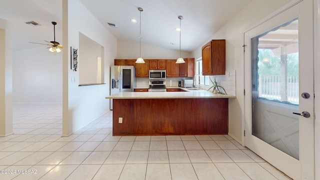 kitchen featuring kitchen peninsula, tasteful backsplash, lofted ceiling, appliances with stainless steel finishes, and ceiling fan