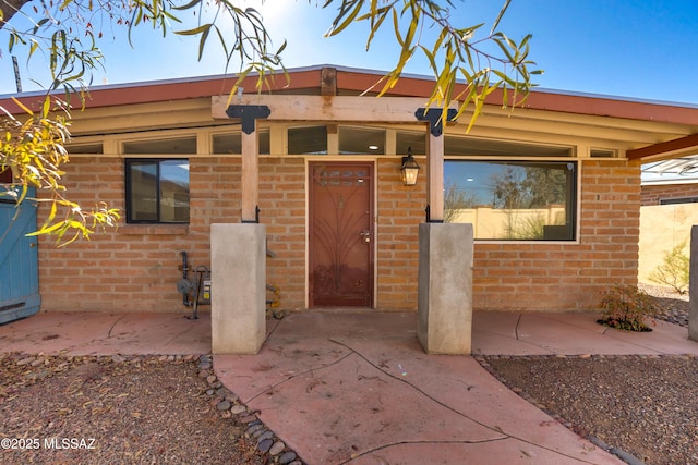 doorway to property featuring a patio