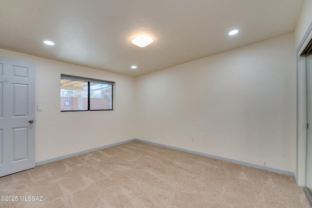 kitchen with recessed lighting, dark countertops, decorative backsplash, white cabinetry, and black fridge