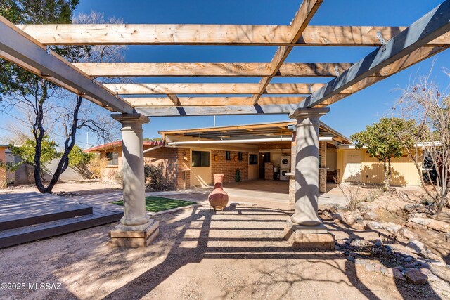 single story home with driveway, a carport, fence, a patio, and a wooden deck