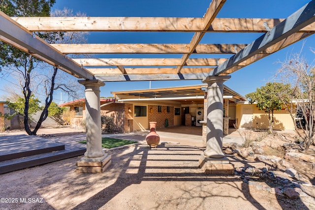 view of patio with a wooden deck and a pergola