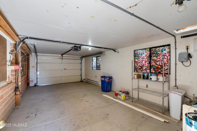 garage featuring a garage door opener and a workshop area