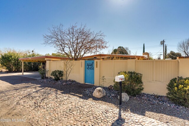 exterior space featuring a gate