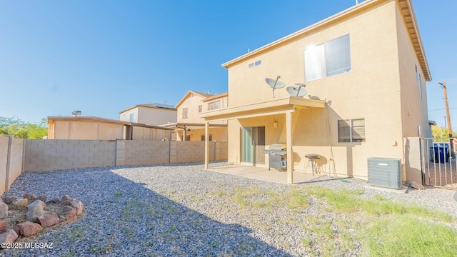 back of property featuring a patio area and cooling unit