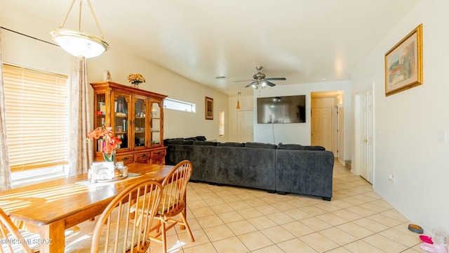 dining space featuring ceiling fan and light tile patterned flooring