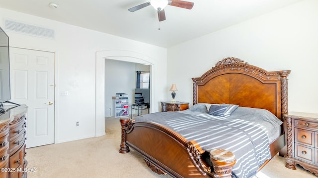 bedroom with ceiling fan and light colored carpet