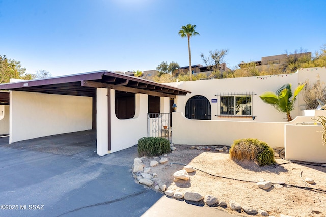 view of front of home featuring a carport