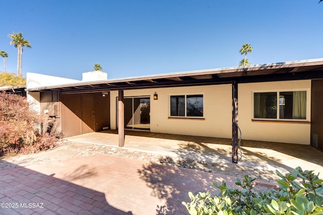 back of house with a patio area