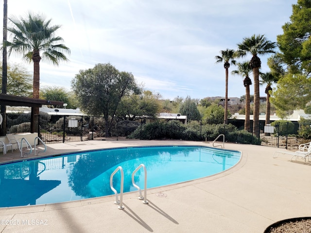 view of swimming pool with a patio