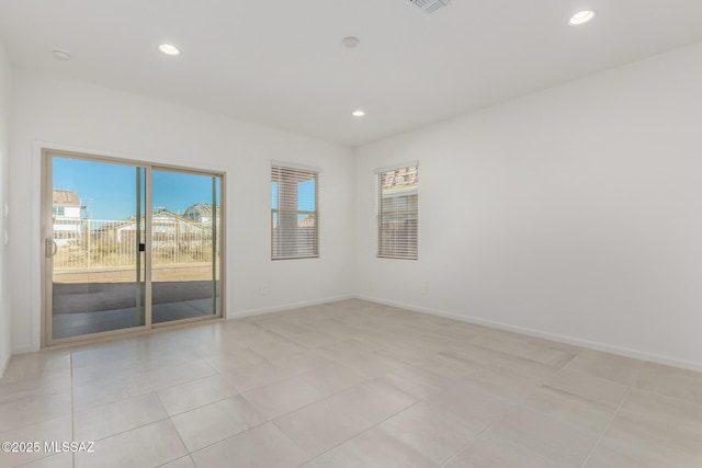 empty room featuring light tile patterned floors