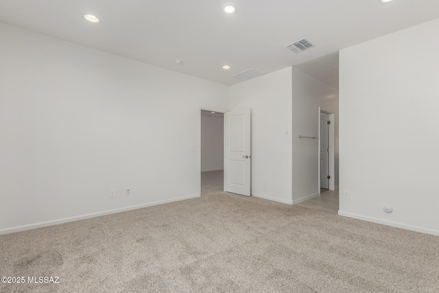 unfurnished bedroom featuring light carpet