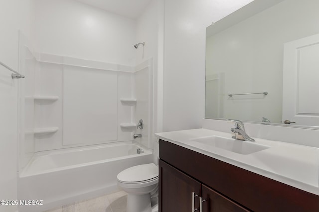 full bathroom featuring tile patterned floors, washtub / shower combination, vanity, and toilet