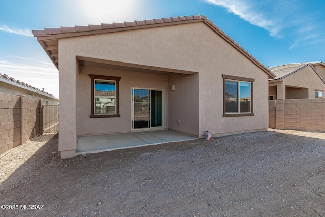 back of property featuring a patio area