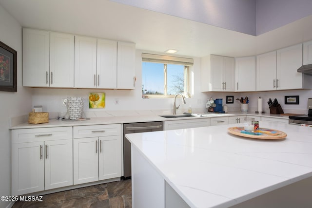 kitchen featuring white cabinetry, a center island, stove, dishwasher, and sink