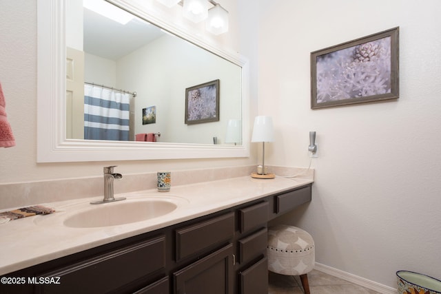 bathroom featuring tile patterned floors and vanity