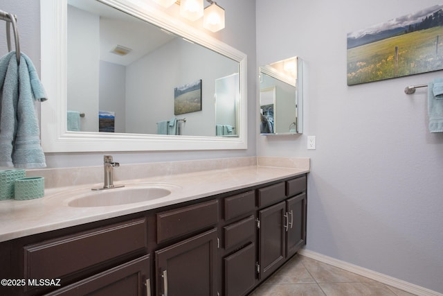 bathroom featuring tile patterned floors and vanity