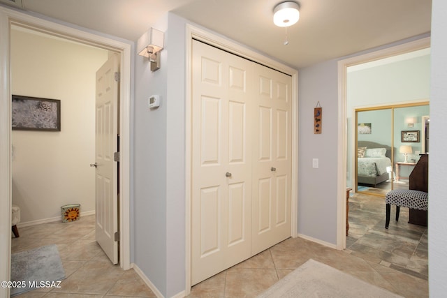 hallway with light tile patterned flooring