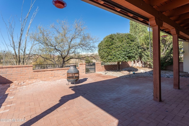 view of patio with an outdoor fire pit