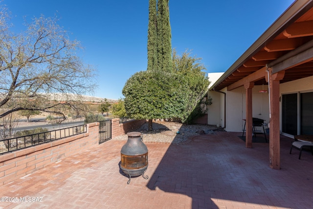 view of patio / terrace with a fire pit