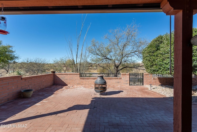 view of patio / terrace featuring a fire pit