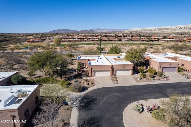 birds eye view of property featuring a mountain view