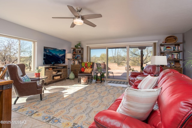 living room with ceiling fan and light tile patterned floors