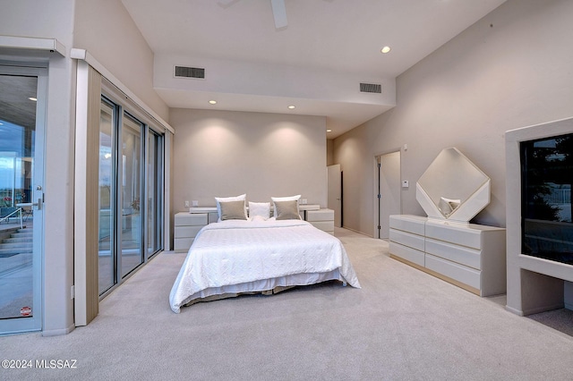 carpeted bedroom with access to outside and ceiling fan