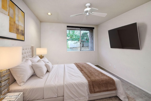 bedroom with ceiling fan and carpet