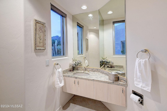 bathroom featuring vanity and tile patterned flooring