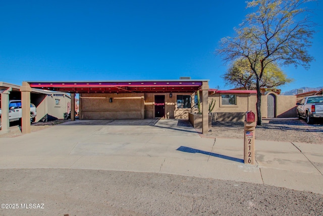 view of front of home featuring a carport