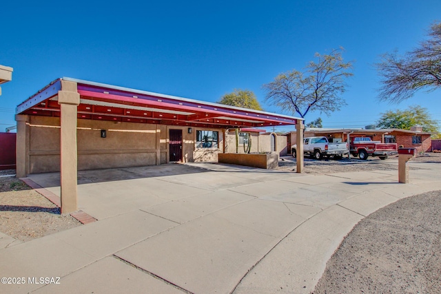 view of front facade with a carport