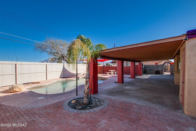 exterior space with a fenced in pool