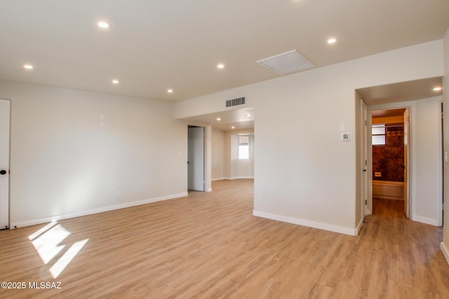 empty room with visible vents, recessed lighting, and light wood-type flooring