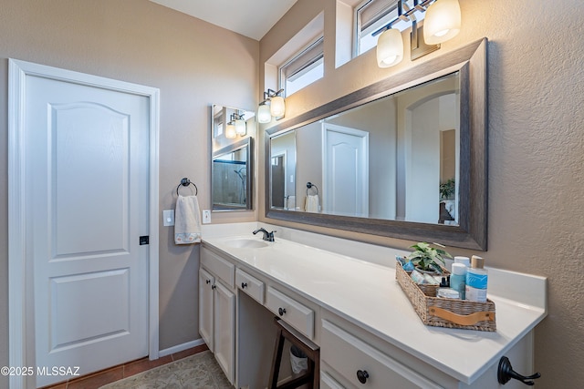 bathroom with tile patterned floors and vanity