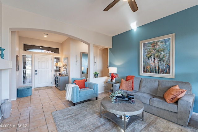 tiled living room featuring ceiling fan