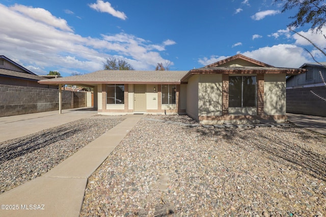 ranch-style home with a carport