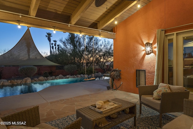 view of patio terrace at dusk