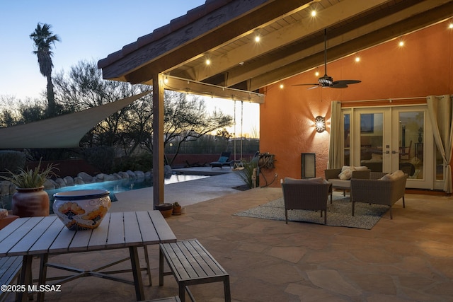 patio terrace at dusk with french doors and ceiling fan