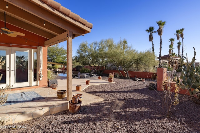 view of yard with a patio and ceiling fan