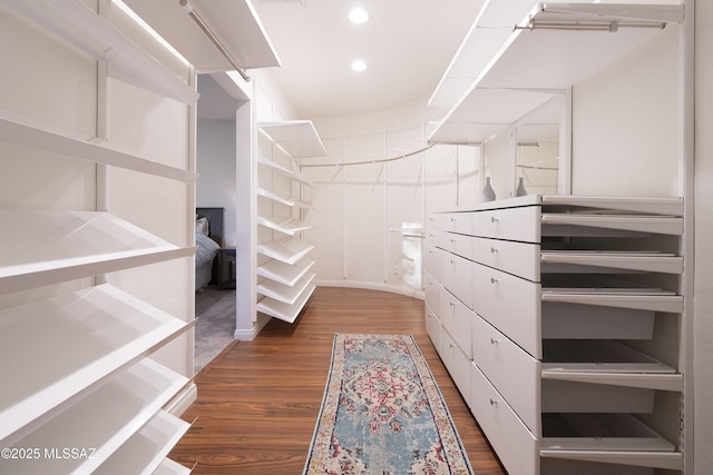 walk in closet featuring dark hardwood / wood-style flooring