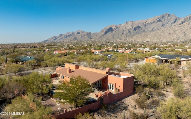 birds eye view of property with a mountain view