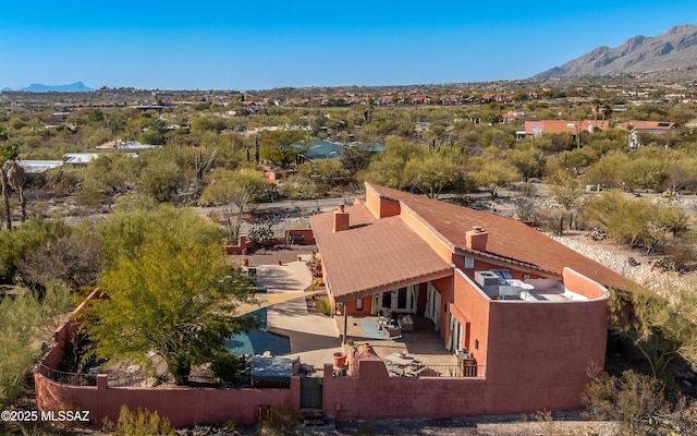 birds eye view of property featuring a mountain view