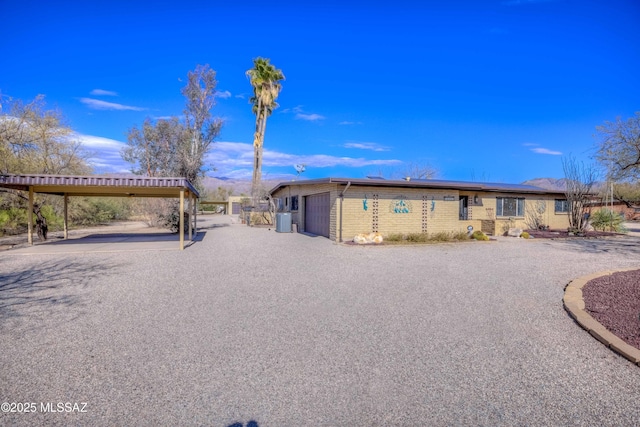 view of front of home featuring a carport and a garage