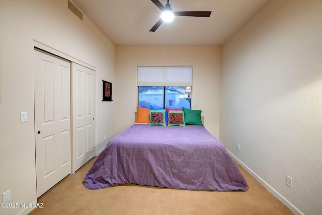 carpeted bedroom with a closet and ceiling fan