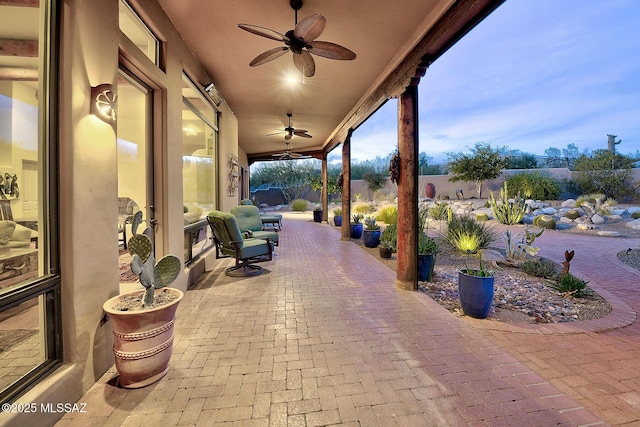 patio terrace at dusk with ceiling fan