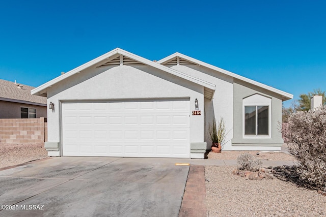 ranch-style home featuring a garage