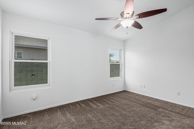 carpeted spare room with ceiling fan